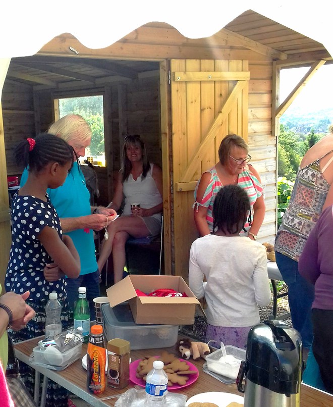 The kitchen end of the marquee. Some of the babies are taking a nap inside the meeting hut. Nice and shady, the sun was very strong for September.