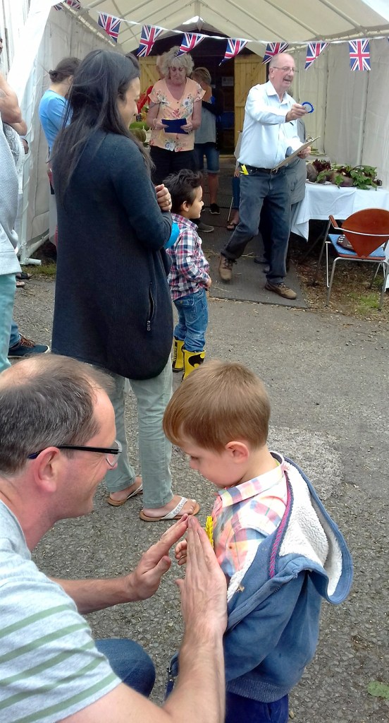 Father and son enjoying a proud moment.