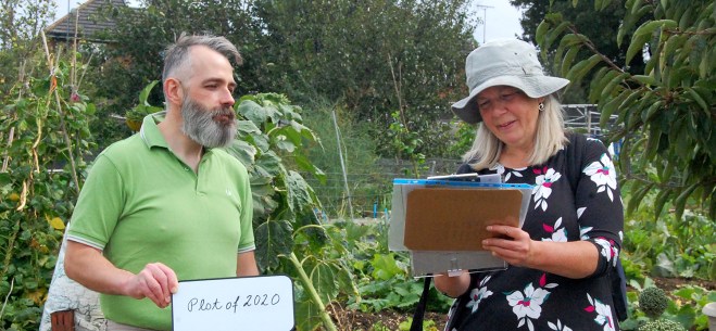 The ‘Plot Holder of the Year 2020’ judge, David, giving his verdicts to Elisabeth, note taker.