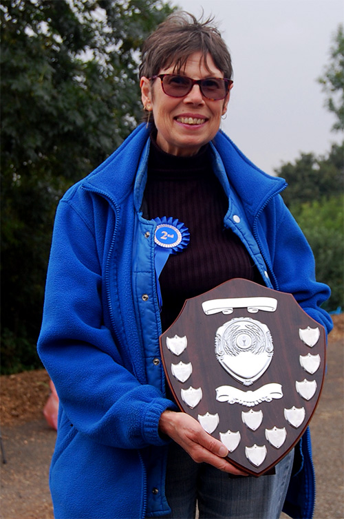 Happy 'Plot Holder of the Year' Gill with the coveted trophy shield
